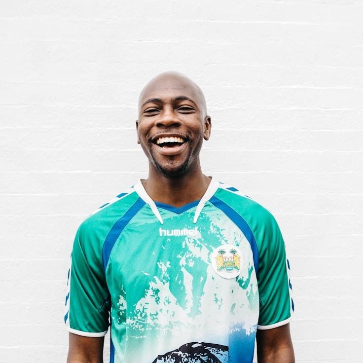 Mira Ali, Lead Design Curator at Stem & Story Studio, reviewing corporate floral arrangements